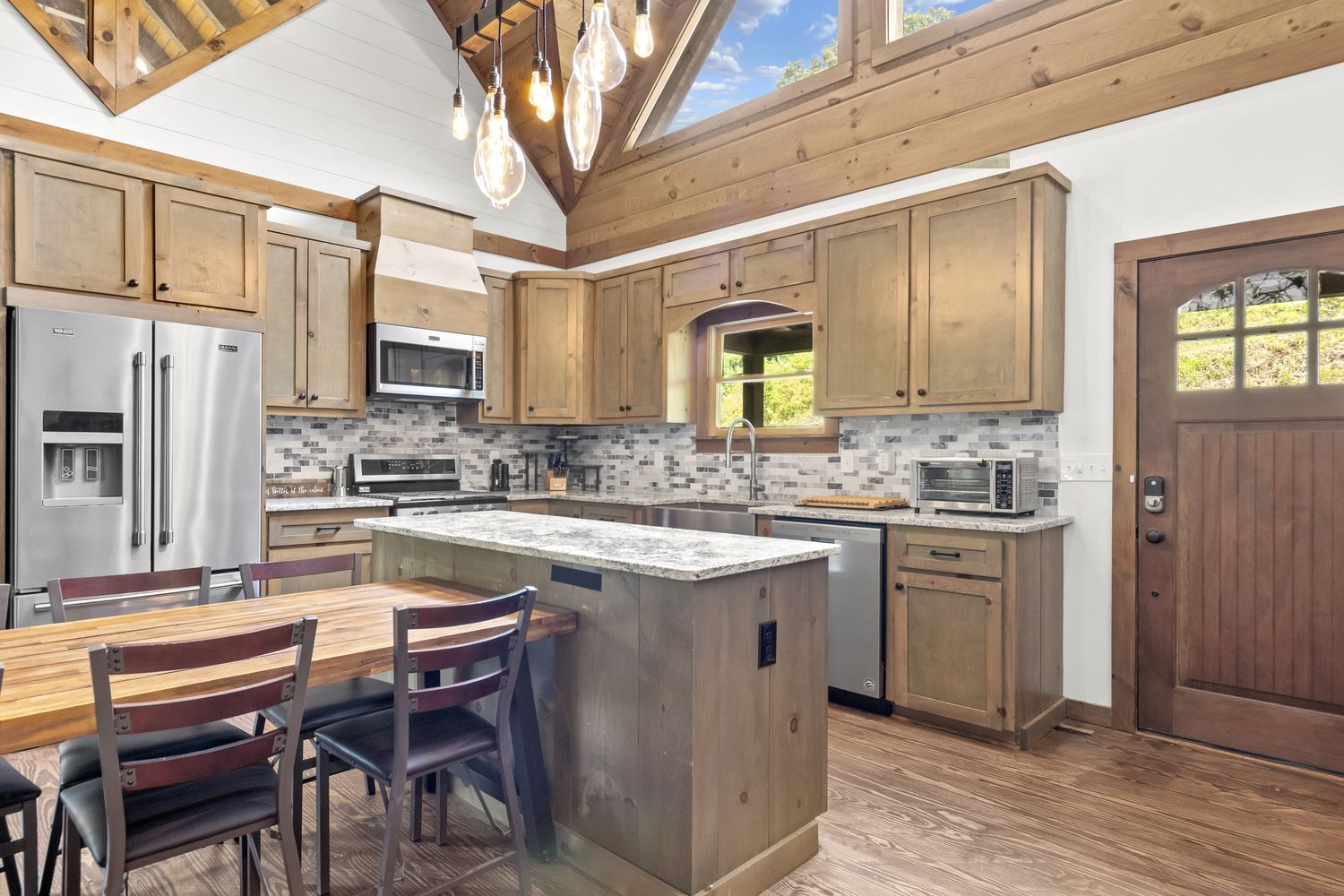 Gourmet kitchen under vaulted ceilings